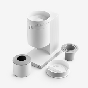 The Fellow Opus coffee grinder with a white finish with additional pieces.