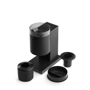 The Fellow Opus coffee grinder with a black finish with additional pieces.