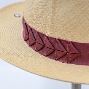 Straw hat with red ribbon