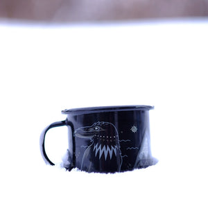 Specialty Coffee Roasters Camp Mug designed by Josh Holland depicting a crow submerged partially in snow.