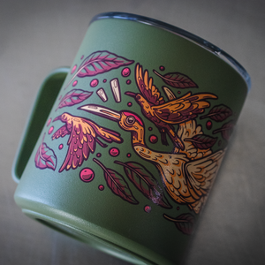 Green MiiR stainless steel camp mug with artwork depicting a crane and a raven.